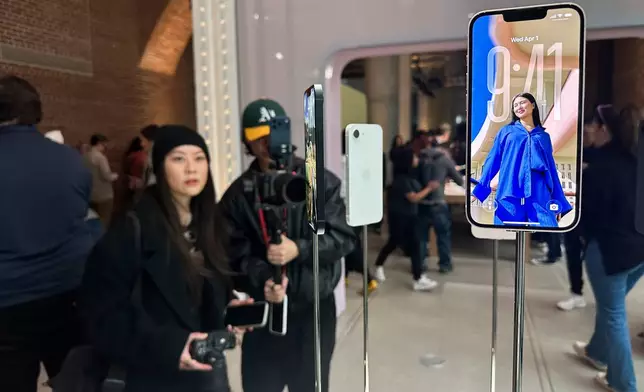The new iPhone 17e sits on display during an Apple unveil event, Wednesday, March 4, 2026, in New York. (AP Photo/Ted Shaffrey) ,