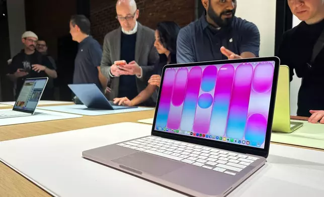 A MacBook Neo sits on display during an Apple unveil event, Wednesday, March 4, 2026, in New York (AP Photo/Ted Shaffrey) ,