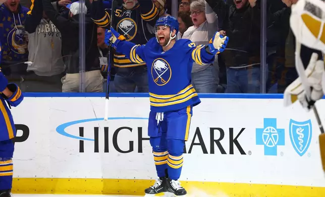 Buffalo Sabres left wing Jason Zucker (17) celebrates his goal during the first period of an NHL hockey game against the Vegas Golden Knights Tuesday, March 3, 2026, in Buffalo, N.Y. (AP Photo/Jeffrey T. Barnes)