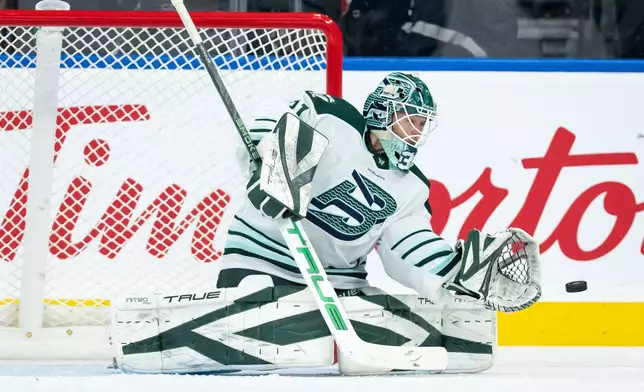 Boston Fleet goaltender Aerin Frankel (31) stops the puck against the Vancouver Goldeneyes during the second period of a PWHL game in Vancouver, on Tuesday, March 10, 2026. (Ethan Cairns/The Canadian Press via AP)