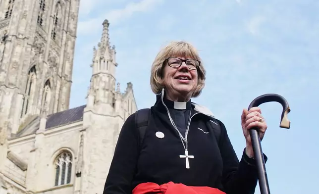 The Archbishop of Canterbury Dame Sarah Mullally poses for a photo after an 87-mile pilgrimage from London to Canterbury Cathedral, in Canterbury, England, Sunday, March 22, 2026. (Gareth Fuller/PA via AP)