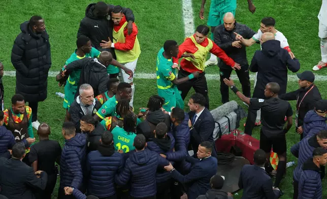 FILE - Players from both sides clash after a controversial penalty was awarded to Morocco late on during the Africa Cup of Nations final soccer match between Senegal and Morocco in Rabat, Morocco, Sunday, Jan. 18, 2026. (AP Photo/Youssef Loulidi, File)
