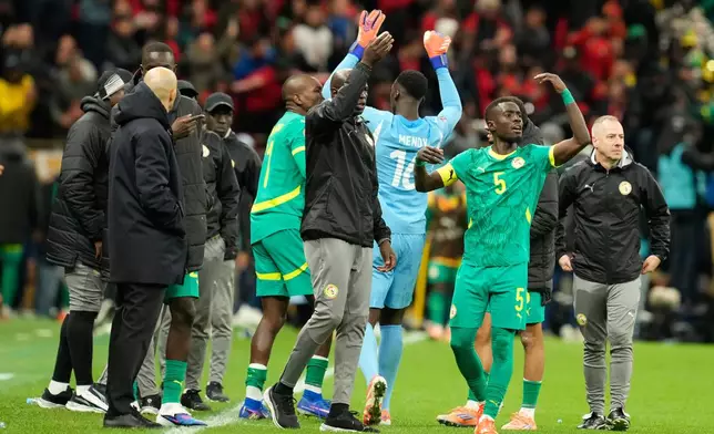 FILE - Senegal's Idrissa Gueye calls players to walk off the ptich during the Africa Cup of Nations final soccer match between Senegal and Morocco, in Rabat, Morocco, Sunday, Jan. 18, 2026. (AP Photo/Mosa'ab Elshamy, File)