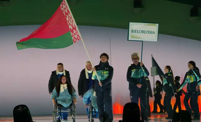 Athletes from Belarus walk during the opening ceremony at the 2026 Winter Paralympics, in Verona, Italy, Friday, March 6, 2026. (AP Photo/Antonio Calanni)