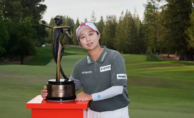 Hyo Joo Kim, of South Korea, poses with the tournament trophy after winning the LPGA Fortinet Founders Cup, Sunday, March 22, 2026, in Menlo Park, Calif. (AP Photo/Godofredo A. Vásquez)