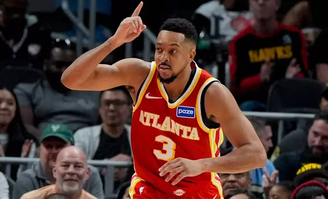 Atlanta Hawks guard CJ McCollum (3) celebrates a basket against the Milwaukee Bucks during the second half of an NBA basketball game, Saturday, March 14, 2026, in Atlanta. (AP Photo/Mike Stewart)