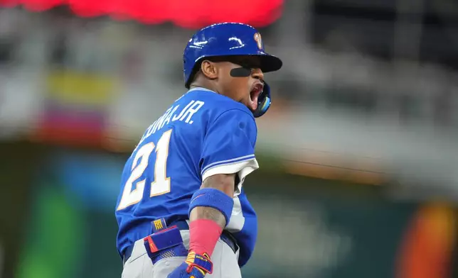 Venezuela's Ronald Acuna Jr. celebrates his single home run during the first inning of a World Baseball Classic quarterfinal game, Saturday, March 14, 2026, in Miami. (AP Photo/Lynne Sladky)