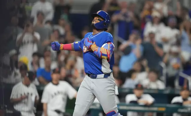 Venezuela's Ronald Acuna Jr. celebrates his single home run during the first inning of a World Baseball Classic quarterfinal game, Saturday, March 14, 2026, in Miami. (AP Photo/Lynne Sladky)
