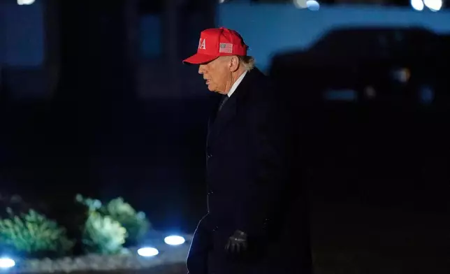 President Donald Trump walks from Marine One after arriving on the South Lawn of the White House, Sunday, March 1, 2026, in Washington. (AP Photo/Jose Luis Magana)