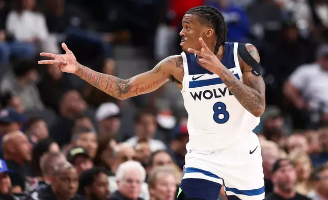 Minnesota Timberwolves guard Bones Hyland gestures after making a 3-point basket during the first half of an NBA basketball game against the Los Angeles Clippers, Wednesday, March 11, 2026, in Inglewood, Calif. (AP Photo/Jessie Alcheh)