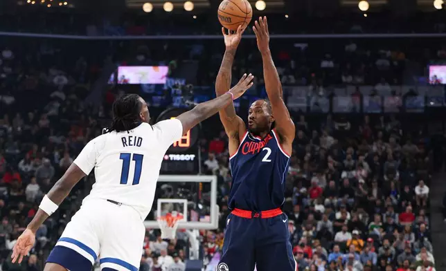 Los Angeles Clippers forward Kawhi Leonard (2) shoots against Minnesota Timberwolves center Naz Reid (11) during the first half of an NBA basketball game, Wednesday, March 11, 2026, in Inglewood, Calif. (AP Photo/Jessie Alcheh)
