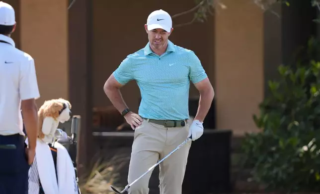 Rory McIlroy, of Northern Ireland, reacts while hitting practice shots during a practice round for The Players Championship golf tournament Wednesday, March 11, 2026, in Ponte Vedra Beach, Fla. (AP Photo/Gerald Herbert)
