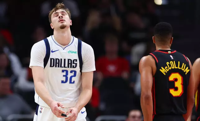 Dallas Mavericks forward Cooper Flagg (32) reacts during the first half of an NBA basketball game against the Atlanta Hawks, Tuesday, March 10, 2026, in Atlanta. (AP Photo/Colin Hubbard)