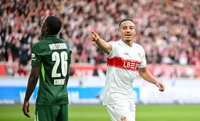 Stuttgart's Jamie Leweling, right, celebrates after scoring during the German Bundesliga soccer match between VfB Stuttgart and VfL Wolfsburg in Stuttgart, Germany, Sunday, March 1, 2026. (Harry Langer/dpa via AP)