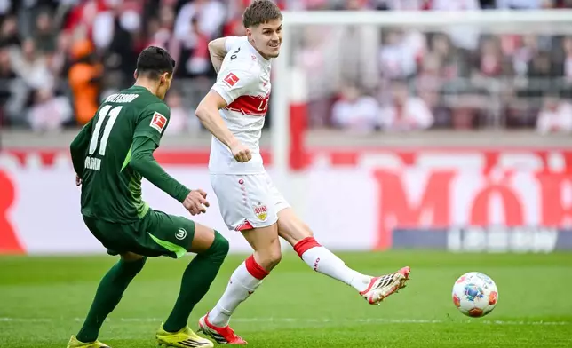 Wolfsburg's Adam Daghim, left, in action against Stuttgart's Adam Daghim during the German Bundesliga soccer match between VfB Stuttgart and VfL Wolfsburg in Stuttgart, Germany, Sunday, March 1, 2026. (Harry Langer/dpa via AP)