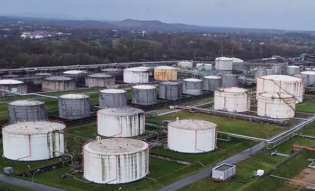 Big oil tanks are pictured in front the BP refinery in Gelsenkirchen, one of the biggest fuel producers in Germany, Wednesday, March 11, 2026. (AP Photo/Martin Meissner)