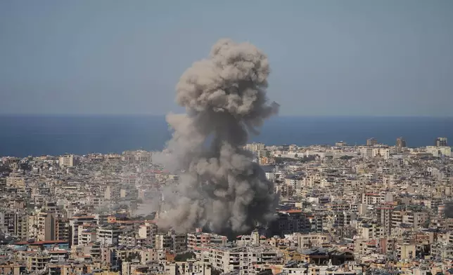 Smoke rises from a building following an Israeli airstrike in Dahiyeh, Beirut's southern suburb, Wednesday, March 11, 2026. (AP Photo/Hassan Ammar)