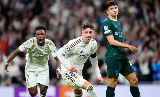 Real Madrid's Federico Valverde, center, celebrates after scoring during a first leg round of 16 Champions League soccer match between Real Madrid and Manchester City in Madrid, Spain, Wednesday, March 11, 2026. (AP Photo/Jose Breton)