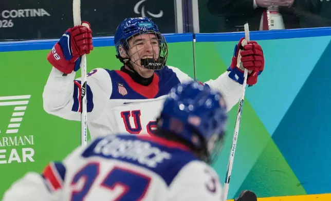 United States's Jack Wallace celebrates after scoring his side's first goal during a gold medal ice hockey match between United States and Canada at the 2026 Winter Paralympics, in Milan, Italy, Sunday, March 15, 2026. (AP Photo/Luca Bruno)