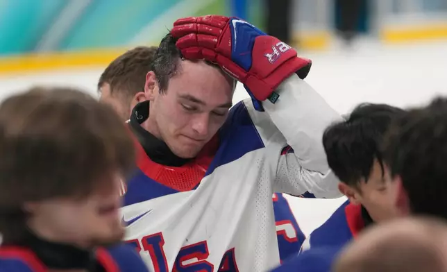 United States's Jack Wallace celebrates after winning the gold medal at the end of the ice hockey match between United States and Canada at the 2026 Winter Paralympics, in Milan, Italy, Sunday, March 15, 2026. (AP Photo/Luca Bruno)
