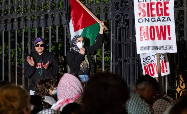 FILE - Leqaa Kordia, center, demonstrates with pro-Palestianian protesters at Columbia University in New York, April 30, 2024. (AP Photo/Craig Ruttle, File)