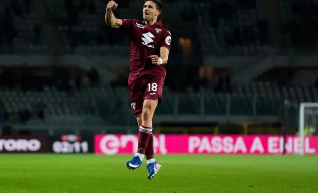 Torino's Giovanni Simeone celebrates after scoring during the Serie A soccer match between Torino FC and Parma, Friday, March 13, 2026, in Turin, Italy. (Fabio Ferrari/LaPresse via AP)