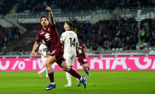 Torino's Giovanni Simeone celebrates after scoring during the Serie A soccer match between Torino FC and Parma, Friday, March 13, 2026, in Turin, Italy. (Fabio Ferrari/LaPresse via AP)