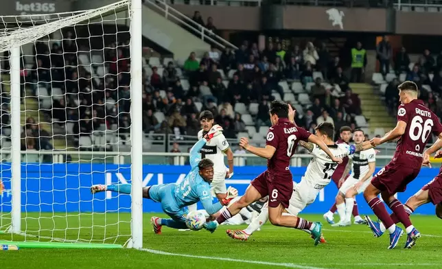 Torino's Emirhan Ilkhan (6) scores their second goal during the Serie A soccer match between Torino FC and Parma, Friday, March 13, 2026, in Turin, Italy. (Fabio Ferrari/LaPresse via AP)