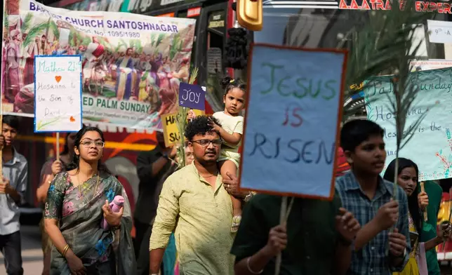 Christian devotees hold palm leaves during a Palm Sunday procession marking the sixth and final Sunday of Lent and the beginning of Holy Week in Hyderabad, India, Sunday, March 29, 2026. (AP Photo/Mahesh Kumar A.)