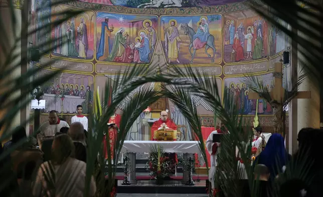 Christian clergy attend a Palm Sunday Mass in Gaza City Sunday, March 29, 2026. (AP Photo/Jehad Alshrafi)