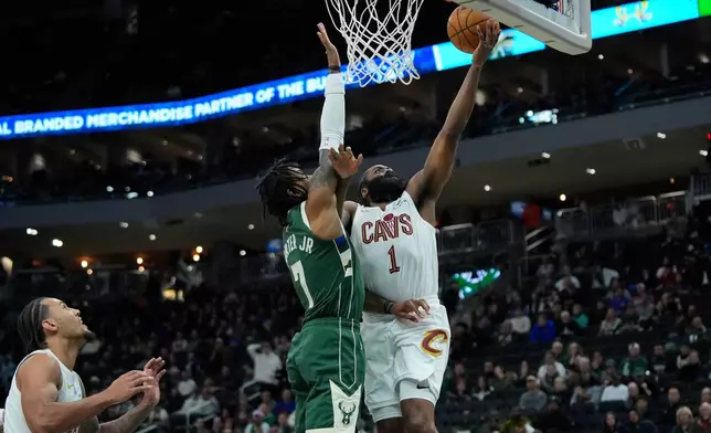 Cleveland Cavaliers' James Harden (1) shoots against Milwaukee Bucks' Kevin Porter Jr. during the first half of an NBA basketball game, Tuesday, March 17, 2026, in Milwaukee. (AP Photo/Aaron Gash)