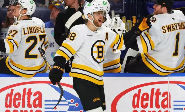 Boston Bruins right wing David Pastrnak (88) celebrates his goal during the first period of an NHL hockey game against the Buffalo Sabres Wednesday, March 25, 2026, in Buffalo, N.Y. (AP Photo/Jeffrey T. Barnes)