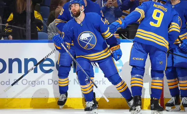 Buffalo Sabres left wing Jason Zucker (17) celebrates his goal during the first period of an NHL hockey game against the Boston Bruins Wednesday, March 25, 2026, in Buffalo, N.Y. (AP Photo/Jeffrey T. Barnes)