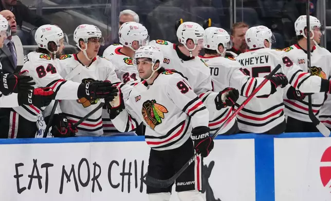 Chicago Blackhawks' Frank Nazar (91) celebrates with teammates after scoring a goal during the second period of an NHL hockey game against the New York Islanders Tuesday, March 24, 2026, in Elmont, N.Y. (AP Photo/Frank Franklin II)