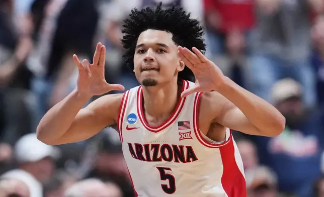 Arizona guard Brayden Burries (5) celebrates after scoring during the second half in the Sweet 16 of the NCAA college basketball tournament against Arkansas, Thursday, March 26, 2026, in San Jose, Calif. (AP Photo/Godofredo A. Vásquez)