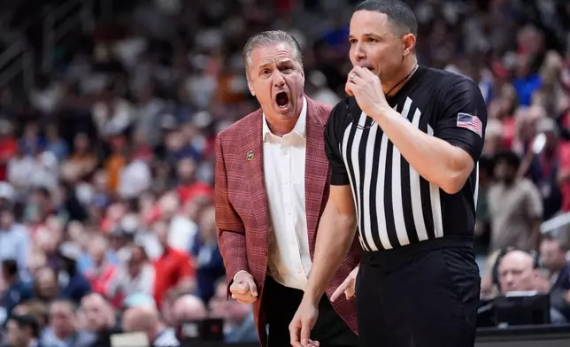 Arkansas head coach John Calipari argues a call during the first half in the Sweet 16 of the NCAA college basketball tournament against Arizona, Thursday, March 26, 2026, in San Jose, Calif. (AP Photo/Godofredo A. Vásquez)
