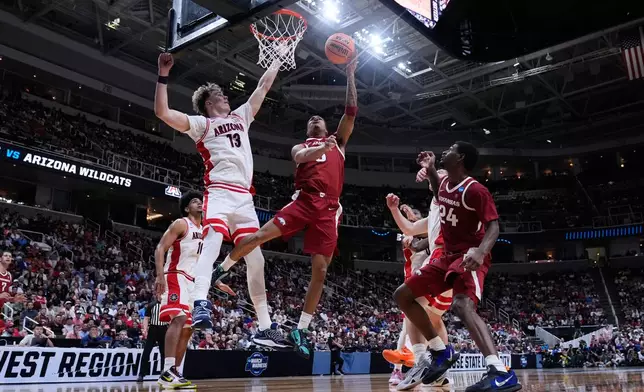 Arkansas guard Darius Acuff Jr. (5) shoots over Arizona center Motiejus Krivas (13) during the second half in the Sweet 16 of the NCAA college basketball tournament, Thursday, March 26, 2026, in San Jose, Calif. (AP Photo/Godofredo A. Vásquez)