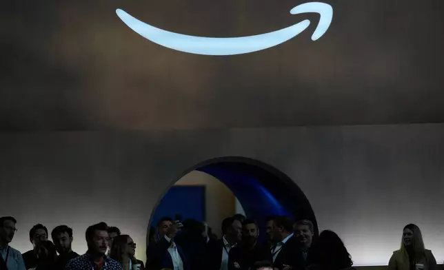 FILE - An Amazon logo is visible at an event in New York, Sept. 30, 2025. (AP Photo/Seth Wenig, File)
