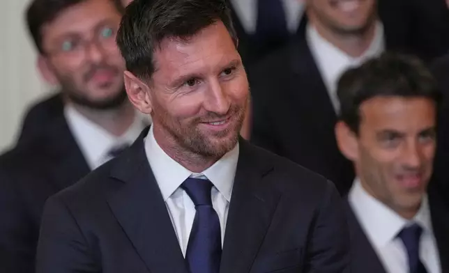 Lionel Messi listens to President Donald Trump speak during an event to honor the 2025 Major League Soccer champions Inter Miami in the East Room of the White House, Thursday, March 5, 2026, in Washington. (AP Photo/Julia Demaree Nikhinson)