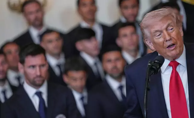 Lionel Messi, left, and teammates listen to President Donald Trump speak during an event to honor the 2025 Major League Soccer champions Inter Miami in the East Room of the White House, Thursday, March 5, 2026, in Washington. (AP Photo/Julia Demaree Nikhinson)