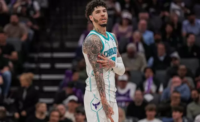 Charlotte Hornets guard LaMelo Ball (1) reacts after a three-point basket during the second half of an NBA basketball game against the Sacramento Kings, Wednesday, March 11, 2026, in Sacramento, Calif. (AP Photo/Justine Willard)