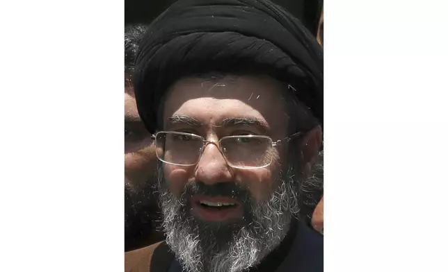 FILE - Mojtaba, son of Iranian Supreme Leader Ayatollah Ali Khamenei, center, attends the annual Quds, or Jerusalem Day rally in Tehran, Iran, on May 31, 2019. (AP Photo/Vahid Salemi, File)