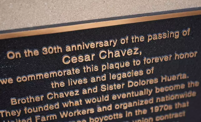A plaque dedicated to the 30th anniversary of the passing of Cesar Chavez, honoring Chavez and Sister Dolores Huerta, is part of the Haymarket Memorial, seen Wednesday, March 18, 2026, in Chicago. (AP Photo/Erin Hooley)