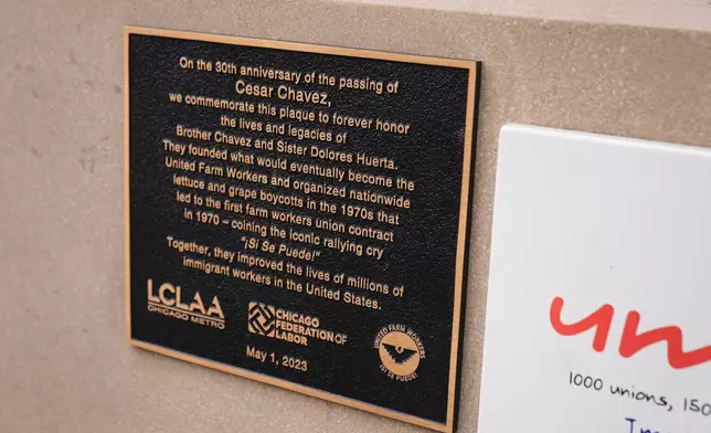 A plaque dedicated to the 30th anniversary of the passing of Cesar Chavez, honoring Chavez and Sister Dolores Huerta, is part of the Haymarket Memorial, seen Wednesday, March 18, 2026, in Chicago. (AP Photo/Erin Hooley)