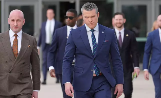 White House deputy chief of staff Stephen Miller, left, and Defense Secretary Pete Hegseth arrive at the inaugural Americas Counter Cartel Conference at U.S. Southern Command in Doral, Fla., Thursday, March 5, 2026. (AP Photo/Rebecca Blackwell)