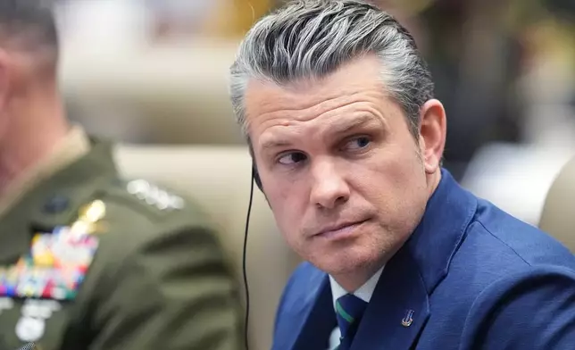 Defense Secretary Pete Hegseth listens during the inaugural Americas Counter Cartel Conference at U.S. Southern Command in Doral, Fla., Thursday, March 5, 2026. (AP Photo/Rebecca Blackwell)