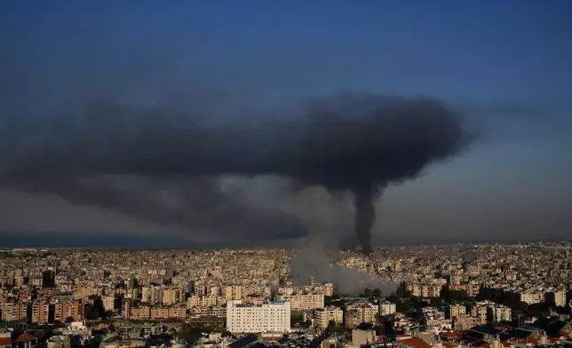 Smoke rises from Israeli airstrikes in Dahiyeh, a southern suburb of Beirut, Lebanon, Tuesday, March 3, 2026. (AP Photo/Hussein Malla)