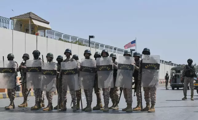 FILE - Paramilitary soldiers take positions at the U.S. Consulate after protesters stormed the building in Karachi, Pakistan, on March 1, 2026. (AP Photo/Ali Raza, File)