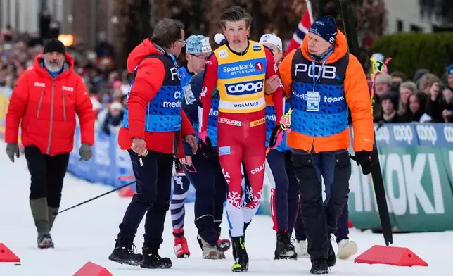 Norway's Johannes Hoesflot Klaebo walks after a fall during the World Cup sprint cross-country race in Drammen, Norway, Thursday March 12, 2026. (Lise Aserud/NTB Scanpix via AP)