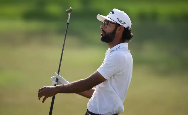 Akshay Bhatia watches his shot on the 13th hole during the final round of the Arnold Palmer Invitational at Bay Hill golf tournament Sunday, March 8, 2026, in Orlando, Fla. (AP Photo/Matt Slocum)